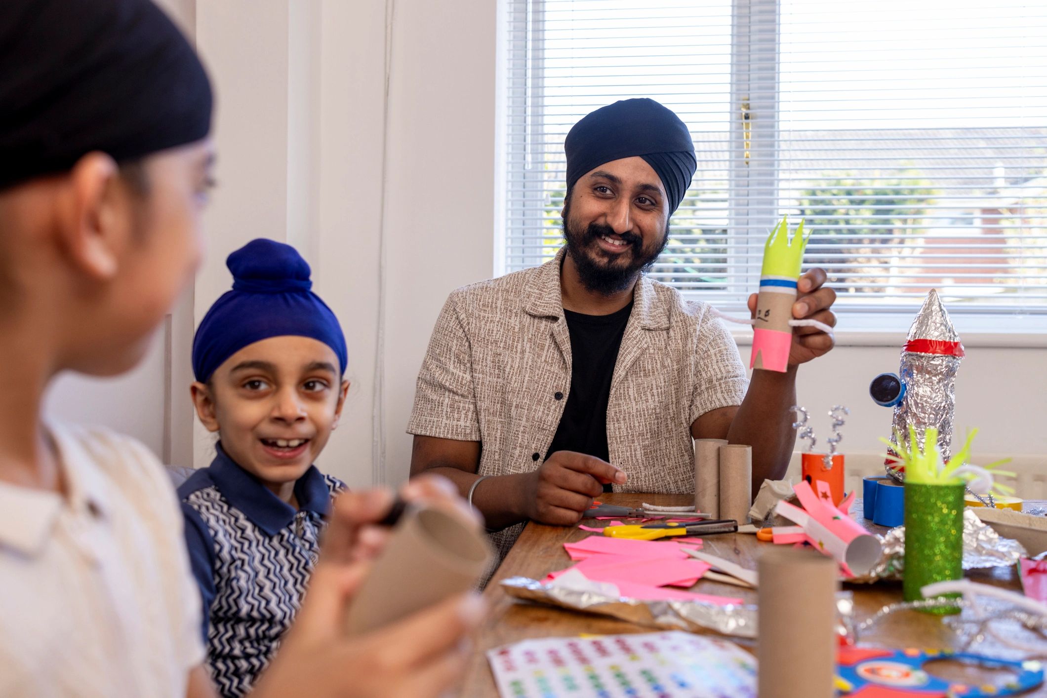 Parent helping children with learning activities at home